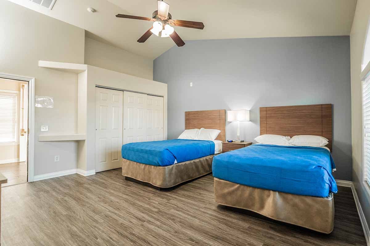 hall view of sunny twin room in nevada addiction rehab center