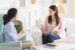 rehab admissions, patient talking with therapist