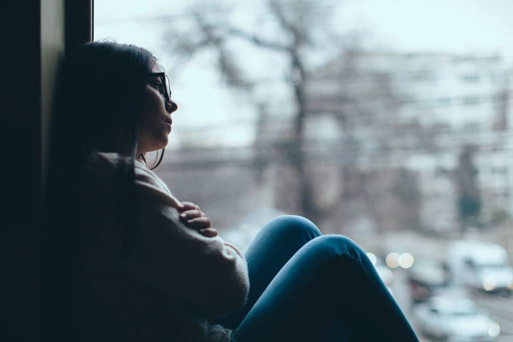 women sitting by a window wondering what drugs are opiates