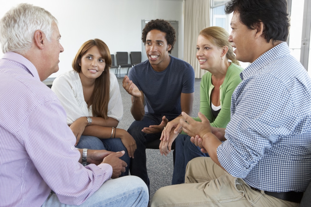 group participating in a 12-step program
