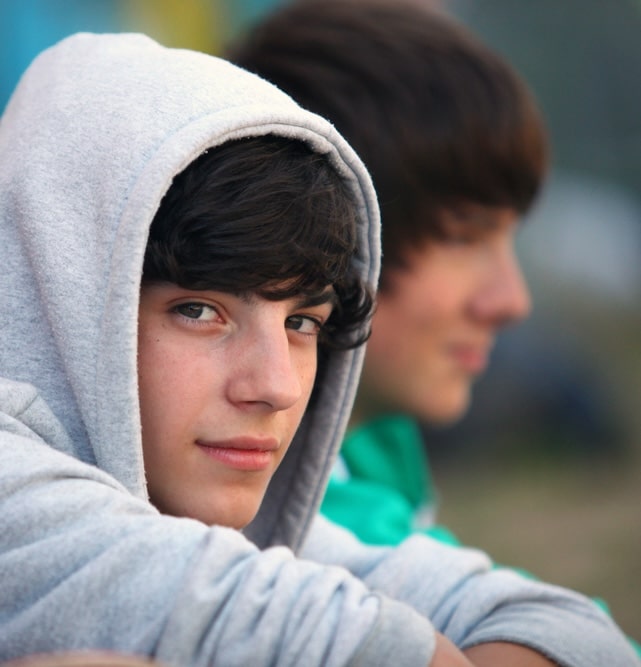 over the counter drugs image teenager sitting outside
